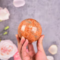 JIC Gem Natural Sunstone Healing Crystal Ball Divination Gemstone Sphere Feng Shui Reiki Aura Crystal Ball Home Desk Decor (60-70mm)
